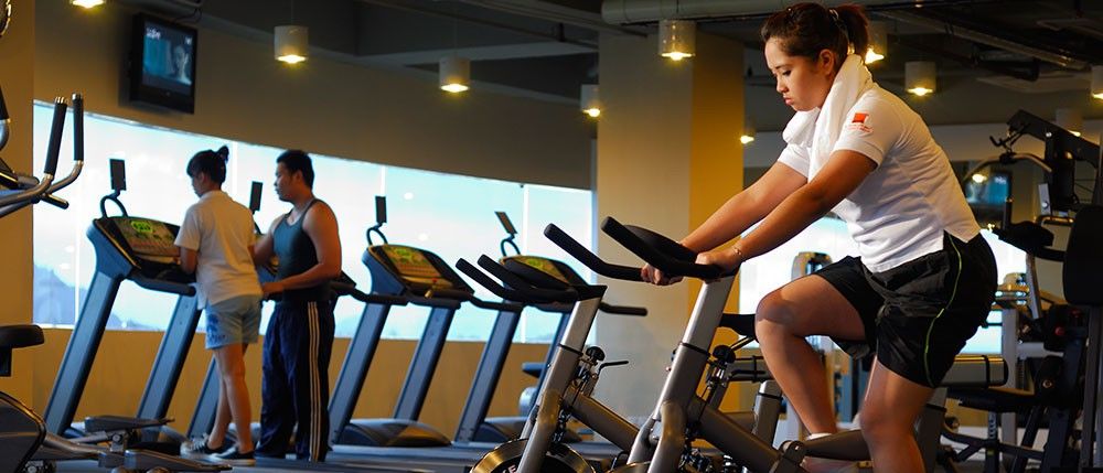 Micasa All Suites Hotel Kuala Lumpur Kültér fotó A woman on a stationary bicycle